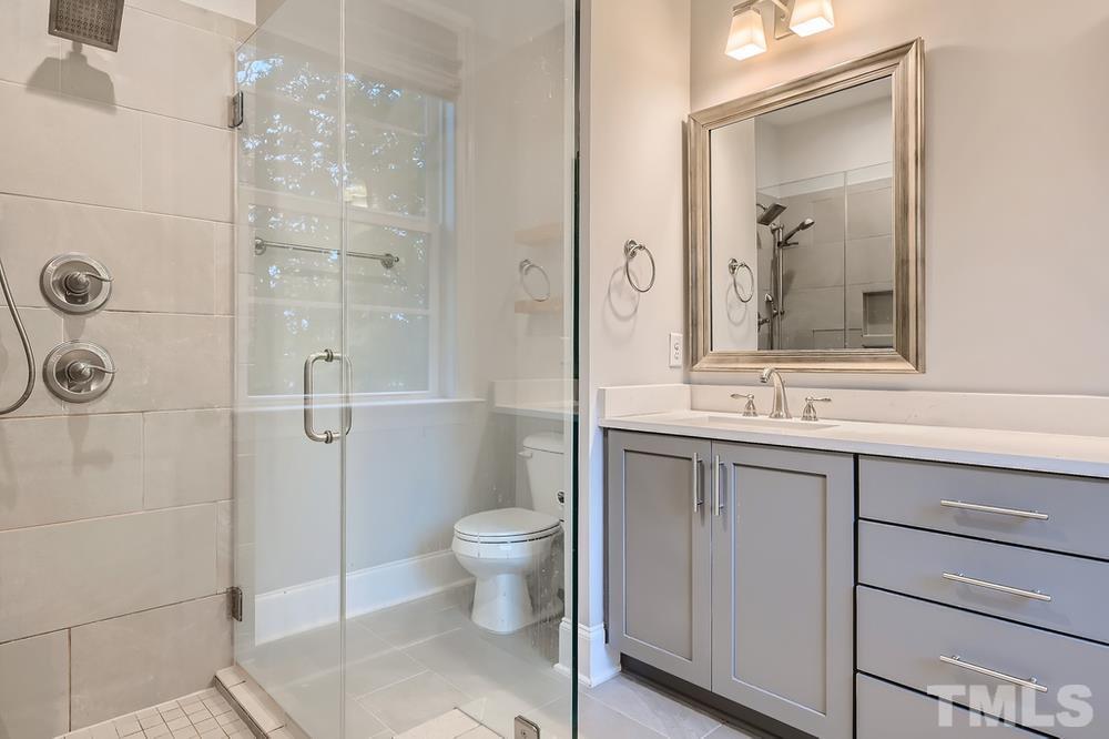 1604 Bowery Drive Raleigh, NC 27607 - Photo 16 of 28 a bathroom with a sink a toilet and shower
