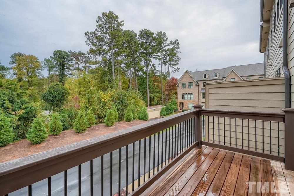 1604 Bowery Drive Raleigh, NC 27607 - Photo 25 of 28 a view of a balcony with wooden fence