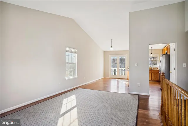 a bedroom with furniture and large window