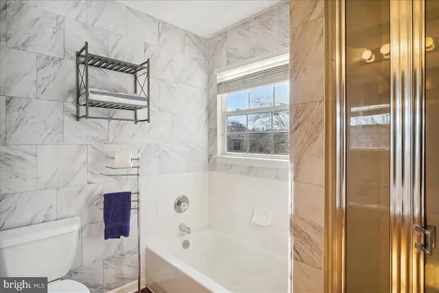 a front view of house with a garden