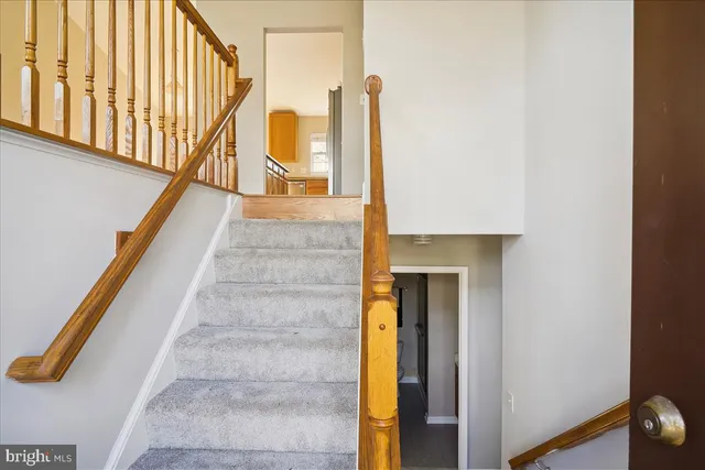 a view of staircase with large windows