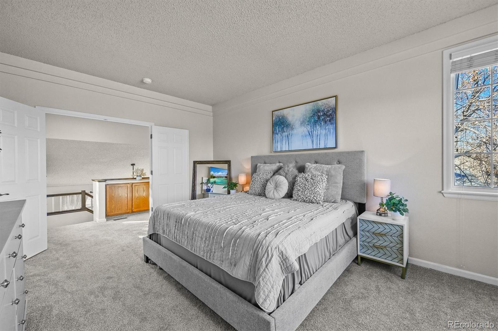2249 Weatherstone Circle Highlands Ranch, CO 80126 - Photo 26 of 46 a bedroom with bed and window