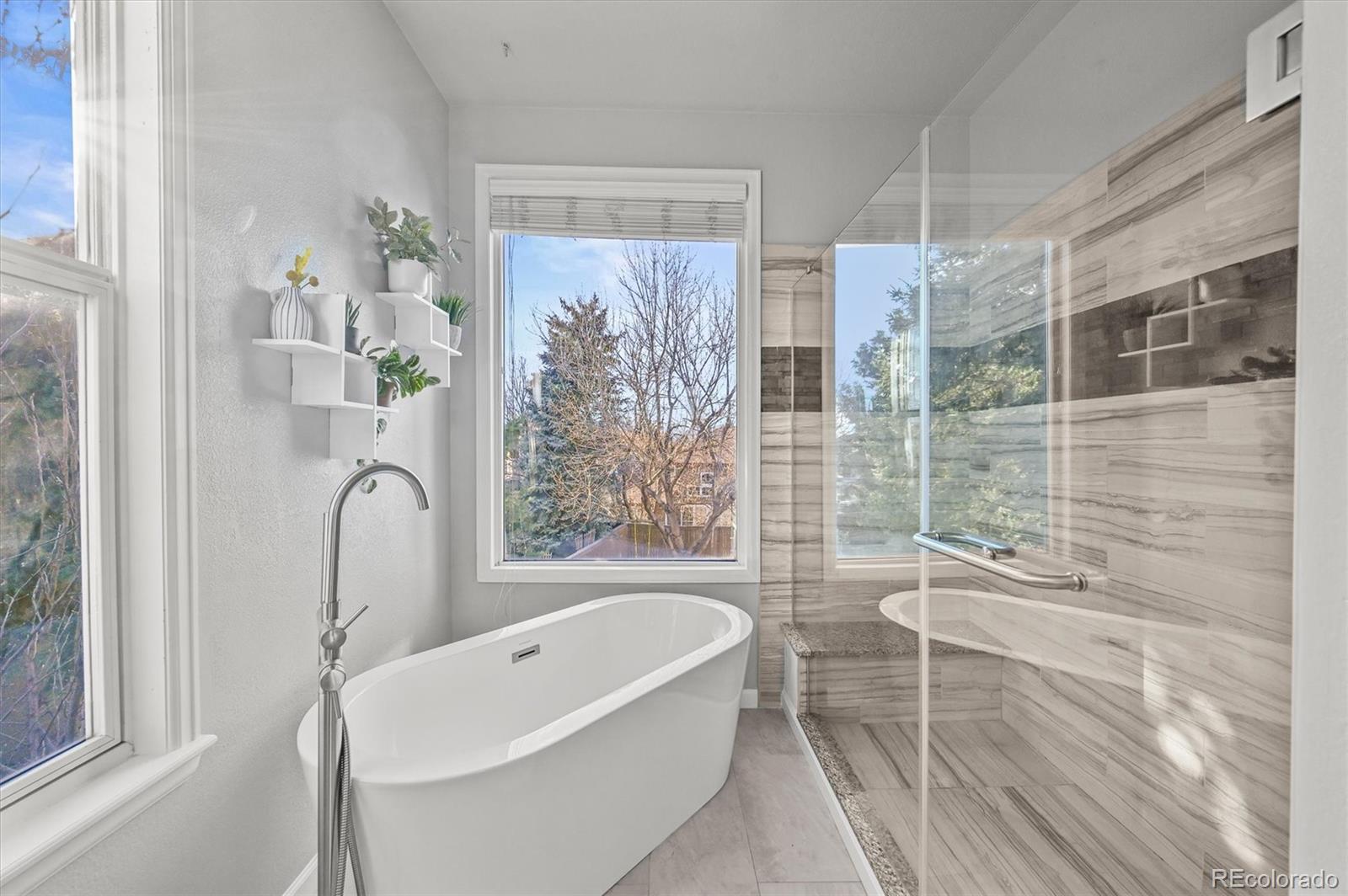 2249 Weatherstone Circle Highlands Ranch, CO 80126 - Photo 28 of 46 a bathroom with a bathtub and shower