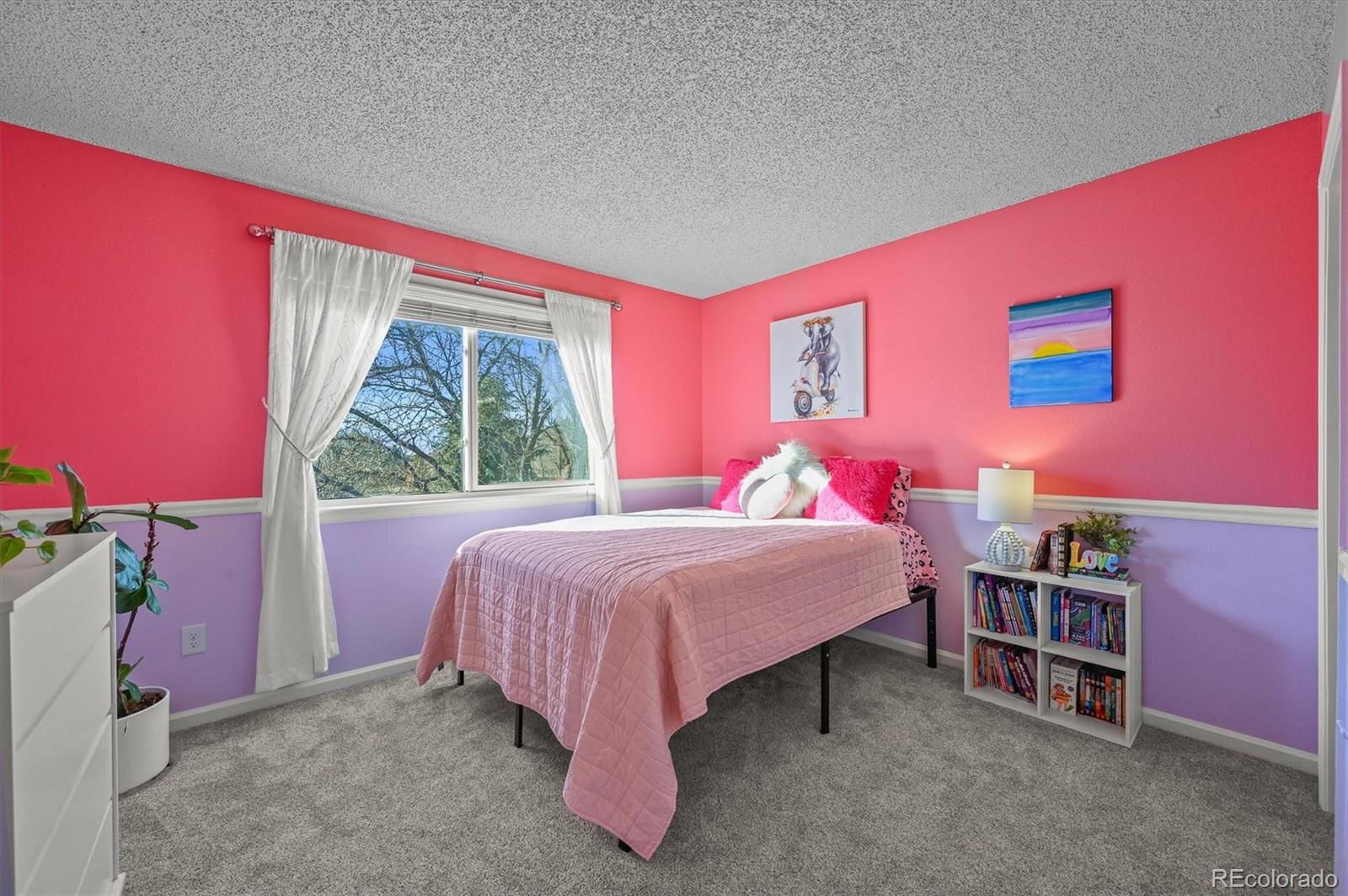 2249 Weatherstone Circle Highlands Ranch, CO 80126 - Photo 30 of 46 a bedroom with a bed and a window