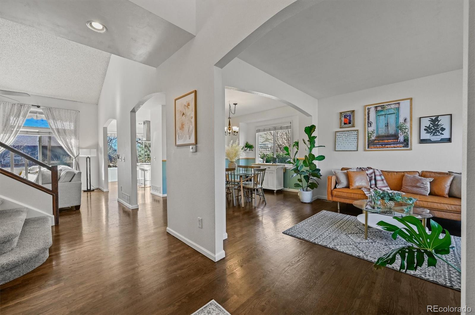 2249 Weatherstone Circle Highlands Ranch, CO 80126 - Photo 3 of 46 a living room with furniture and a wooden floor