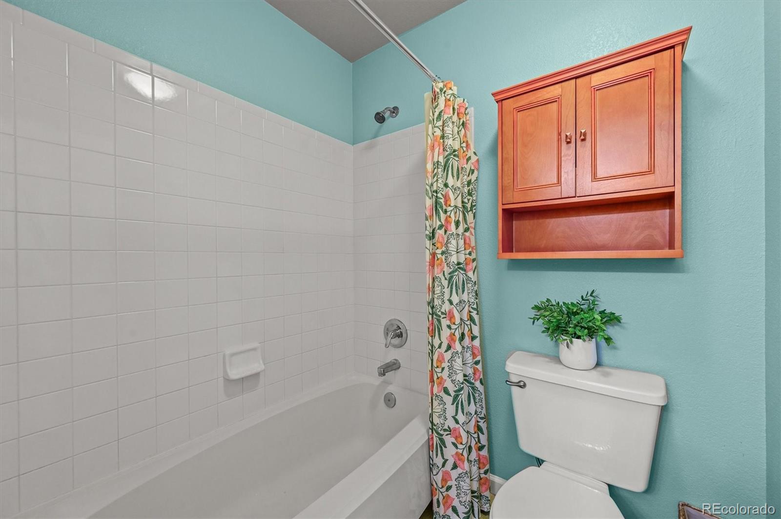 2249 Weatherstone Circle Highlands Ranch, CO 80126 - Photo 33 of 46 a white toilet sitting next to a bath tub