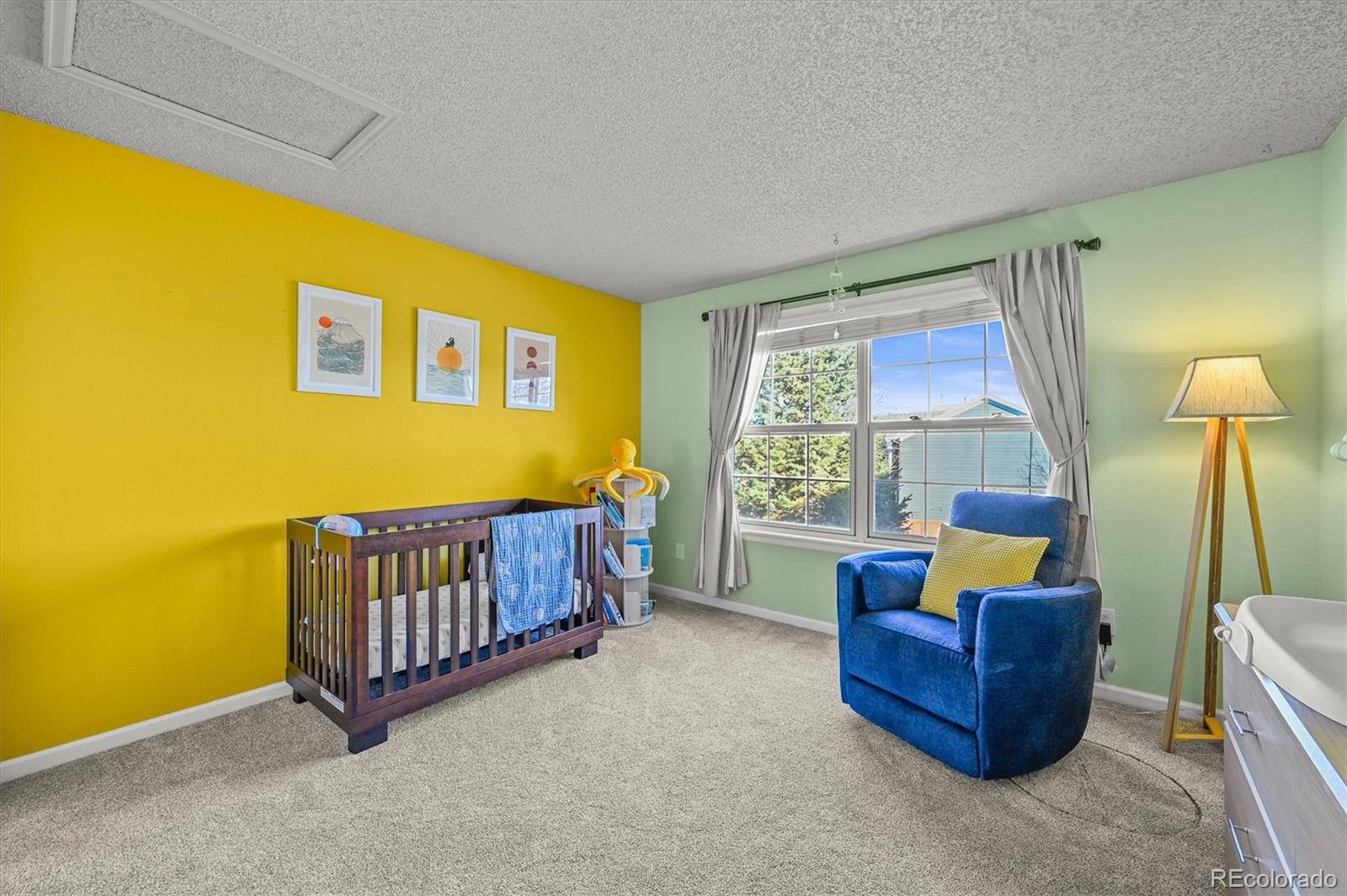 2249 Weatherstone Circle Highlands Ranch, CO 80126 - Photo 34 of 46 a room with furniture and a window