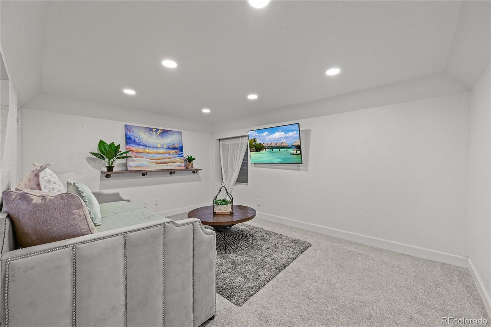 2249 Weatherstone Circle Highlands Ranch, CO 80126 - Photo 36 of 46 a living room with furniture and a wooden floor