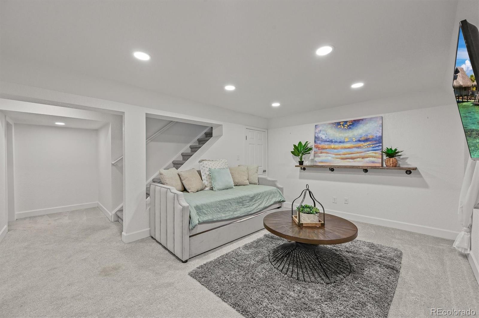 2249 Weatherstone Circle Highlands Ranch, CO 80126 - Photo 37 of 46 a living room with furniture and a rug