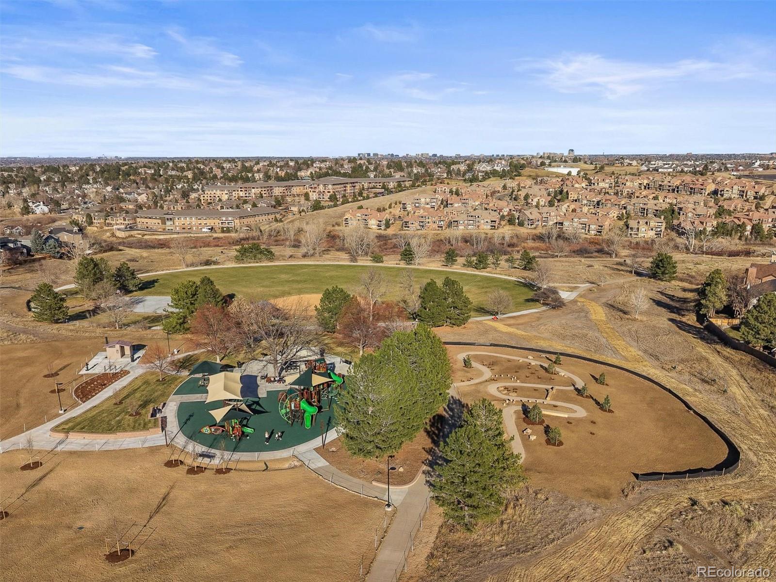 2249 Weatherstone Circle Highlands Ranch, CO 80126 - Photo 44 of 46 an aerial view of a house with a lake view