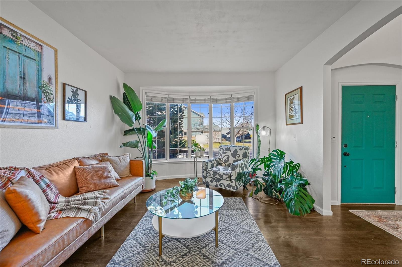 2249 Weatherstone Circle Highlands Ranch, CO 80126 - Photo 5 of 46 a living room with furniture potted plant and window