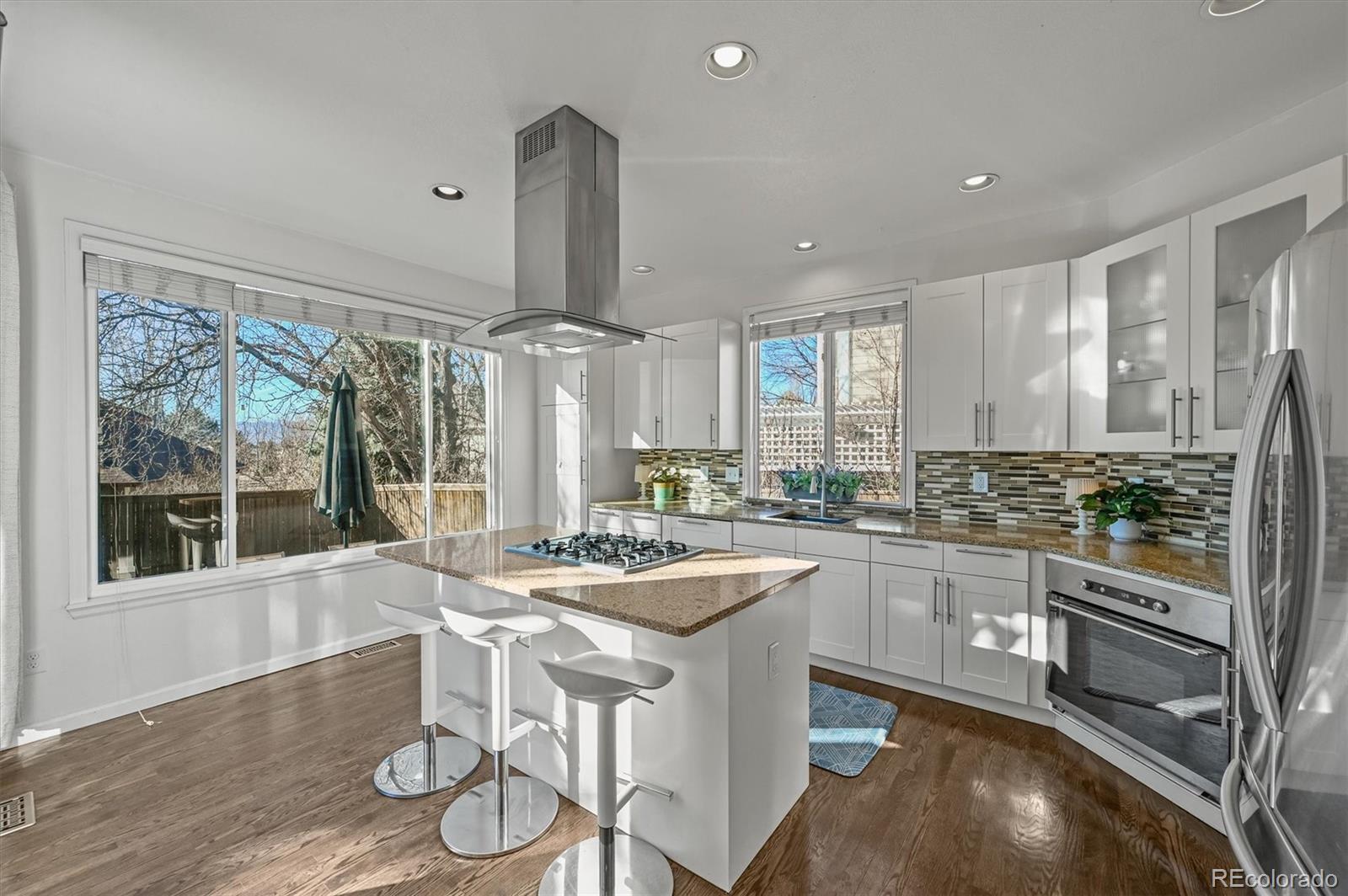 2249 Weatherstone Circle Highlands Ranch, CO 80126 - Photo 10 of 46 a kitchen with stainless steel appliances granite countertop a sink and cabinets