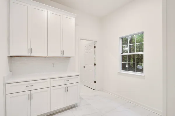 a view of an empty room with windows