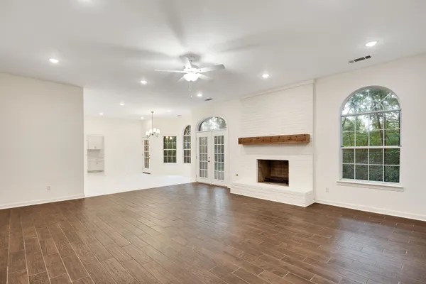 a view of a kitchen with white cabinets