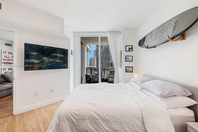 a large white bed in a white room