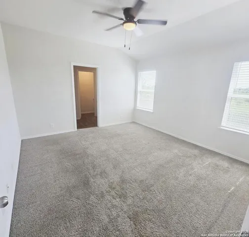 a room with a sink and a mirror