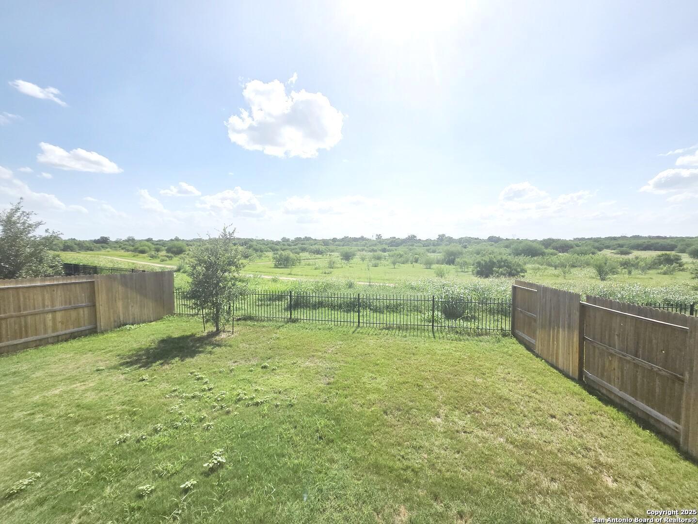 437 Middle Grn Loop Floresville, TX 78114 - Photo 25 of 25 a view of a lake with a yard
