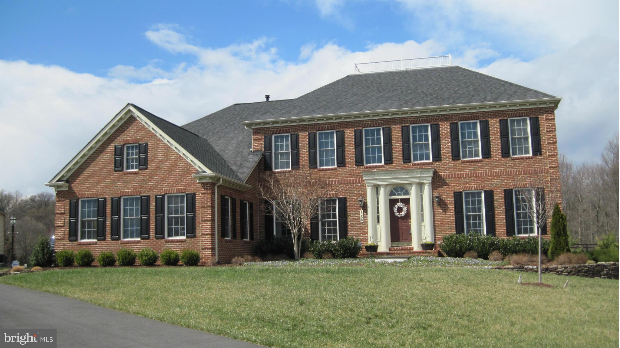 7258 Joshua Tree Circle Warrenton, VA 20187 - Photo 1 of 16 front view of a house with a yard
