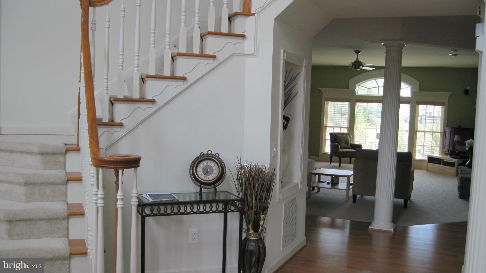 7258 Joshua Tree Circle Warrenton, VA 20187 - Photo 2 of 16 a view of entryway and hall with wooden floor