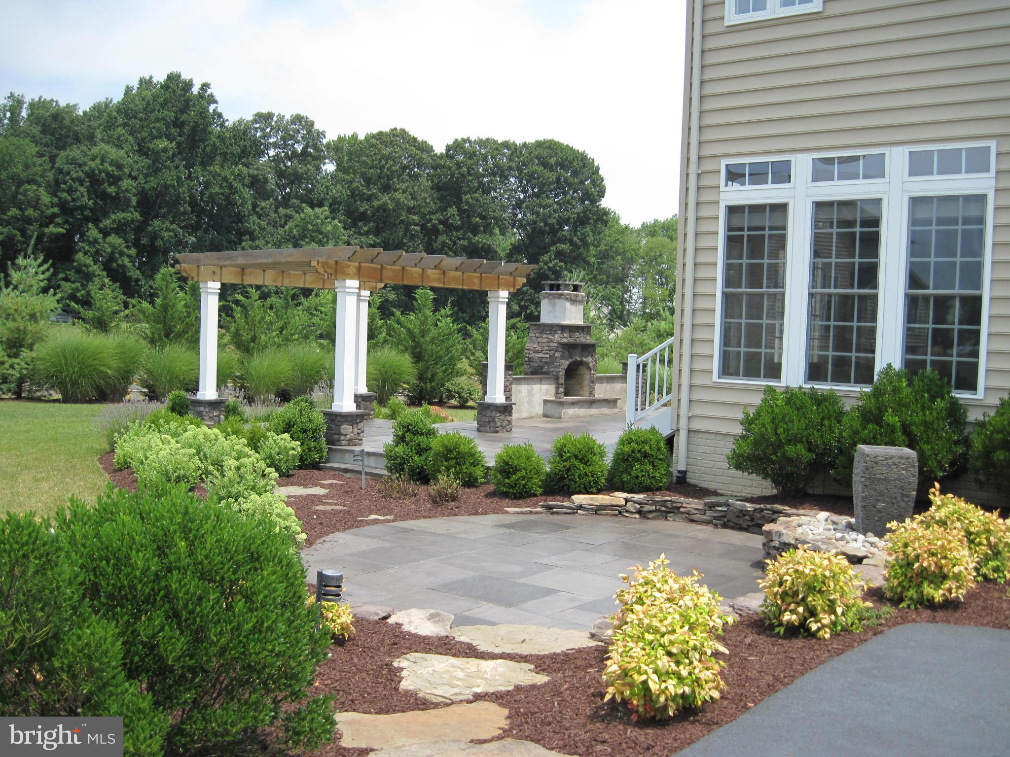 7258 Joshua Tree Circle Warrenton, VA 20187 - Photo 16 of 16 a view of a garden with a fountain