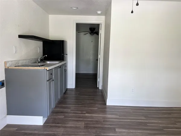 a view of a kitchen from the hallway