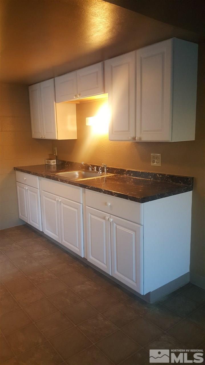 2430 Sutro Street, Unit 4 Reno, NV 89512 - Photo 3 of 6 a kitchen with white cabinets