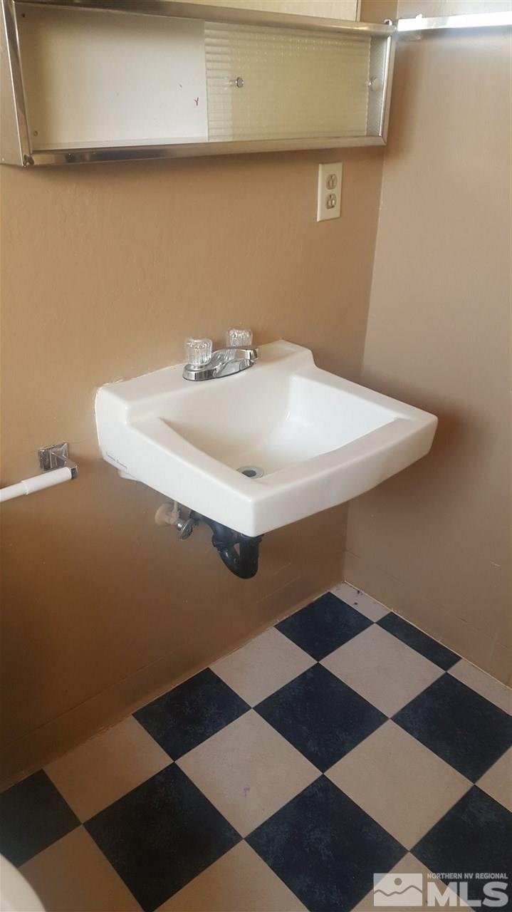 2430 Sutro Street, Unit 4 Reno, NV 89512 - Photo 5 of 6 a bathroom with a sink and a mirror
