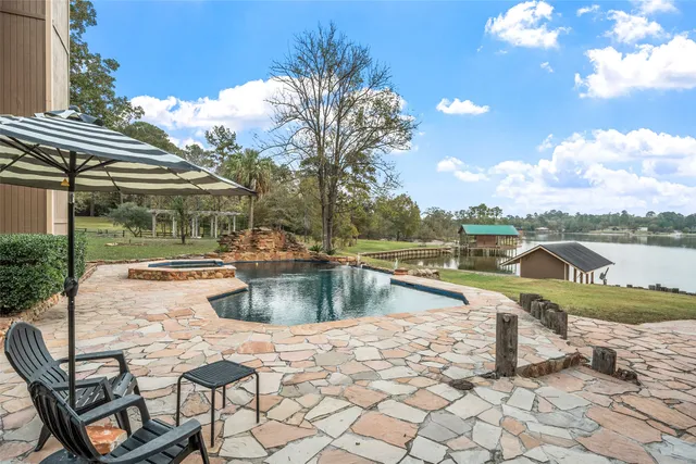 a view of a swimming pool with a lounge chairs