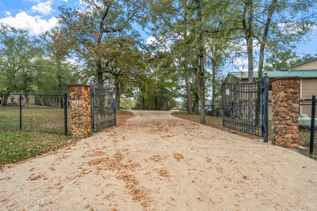 a backyard of a house with large trees