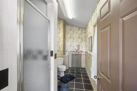 a bathroom with a bathtub and shower