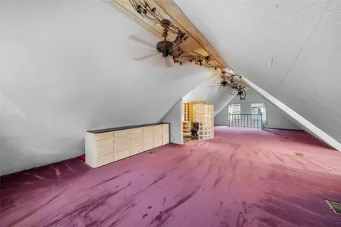 a kitchen with a refrigerator and a stove