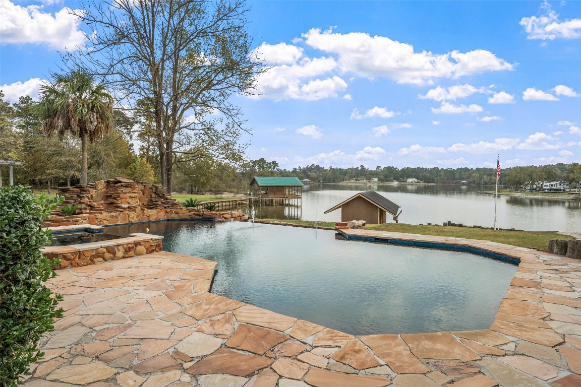 186 Lake Road Huntsville, TX 77320 - Photo 41 of 48 a view of a lake with outdoor space