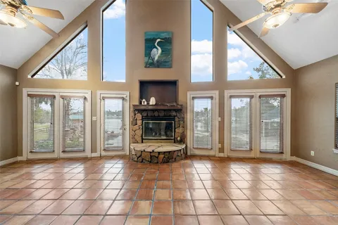 a kitchen that has a lot of cabinets and wooden floor