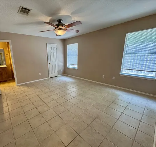 a view of an empty room and window