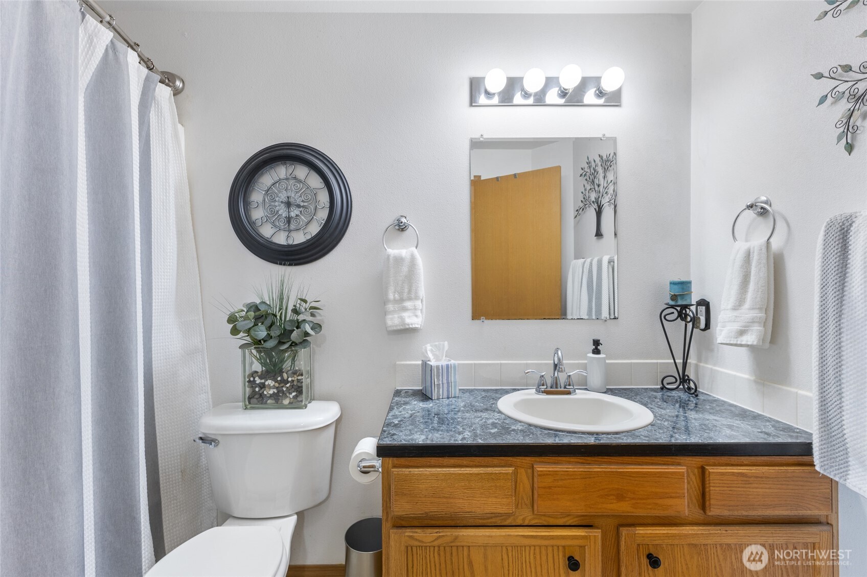 1346 Greens Loop Moses Lake, WA 98837 - Photo 18 of 39 a bathroom with a granite countertop toilet sink and mirror