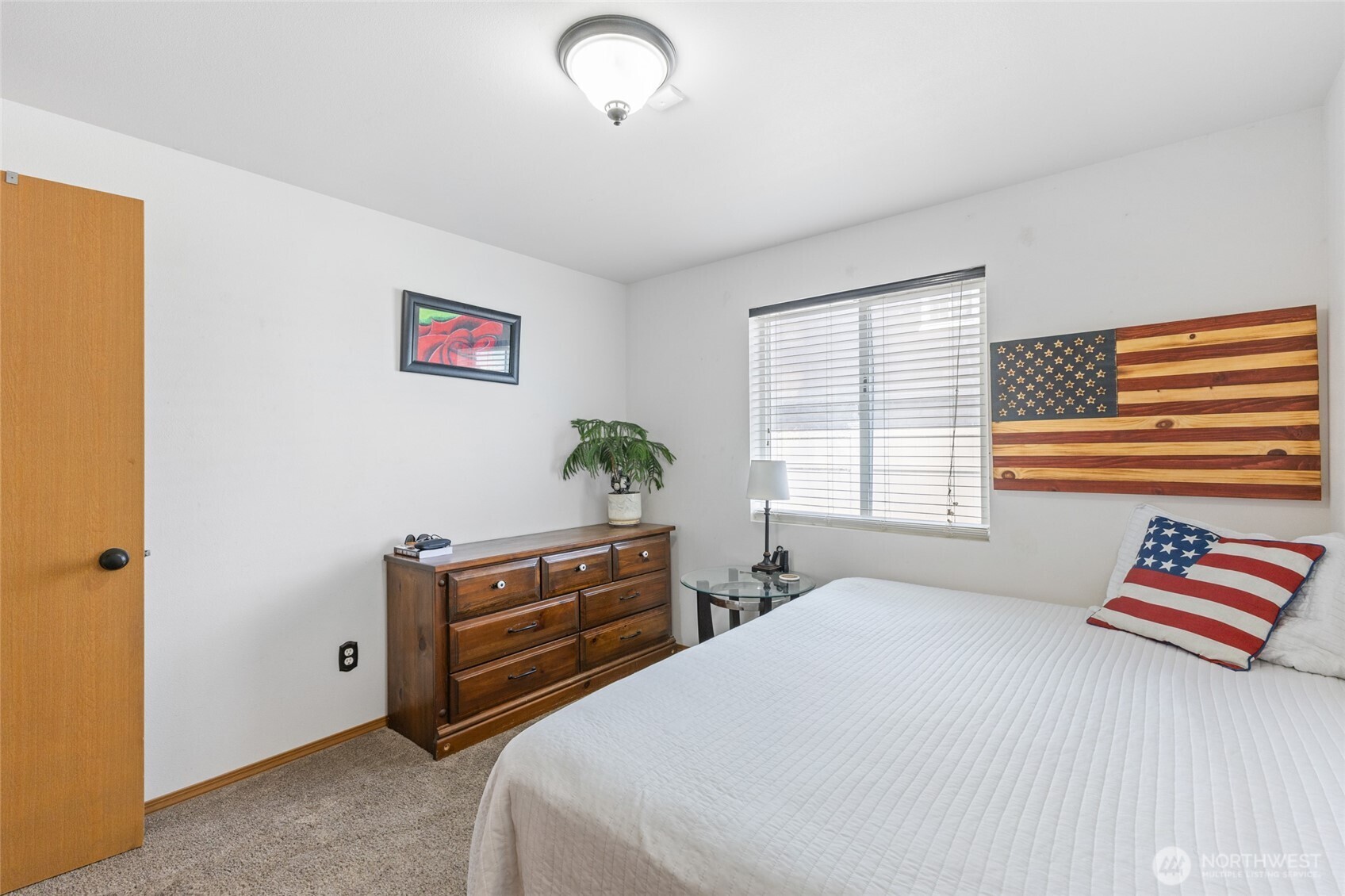 1346 Greens Loop Moses Lake, WA 98837 - Photo 20 of 39 a bedroom with a bed and a painting on the wall