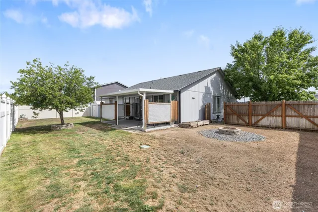 a view of a house with a yard and garage