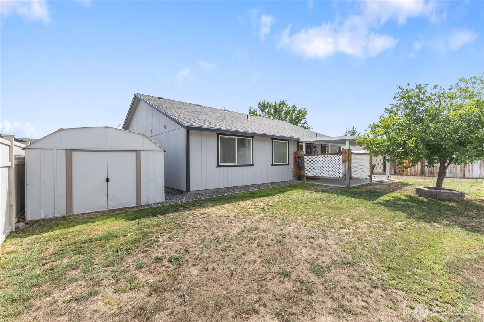 1346 Greens Loop Moses Lake, WA 98837 - Photo 30 of 39 a view of a house with a backyard