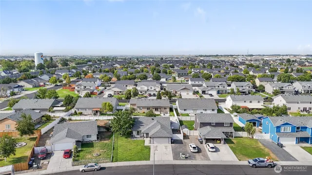 an aerial view of a houses with a lake view