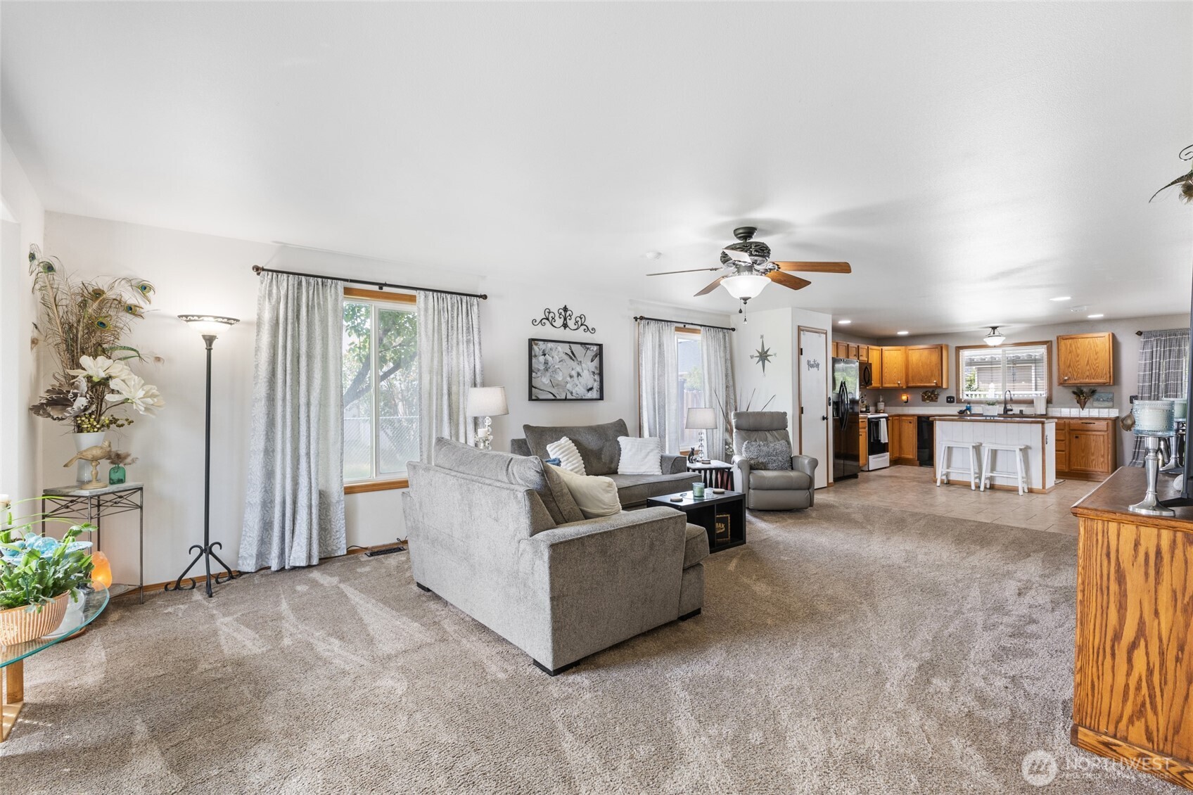 1346 Greens Loop Moses Lake, WA 98837 - Photo 7 of 39 a living room with furniture and a chandelier