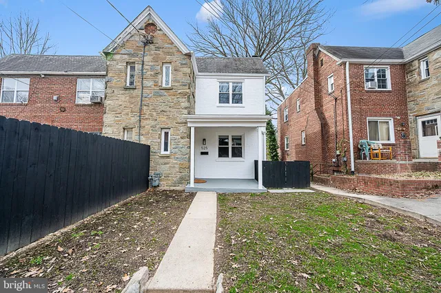 front view of a house with a yard