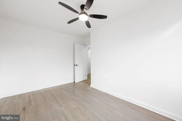 a view of a small space with wooden floor