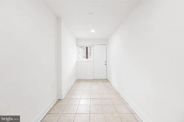 a view of a brick house with many windows