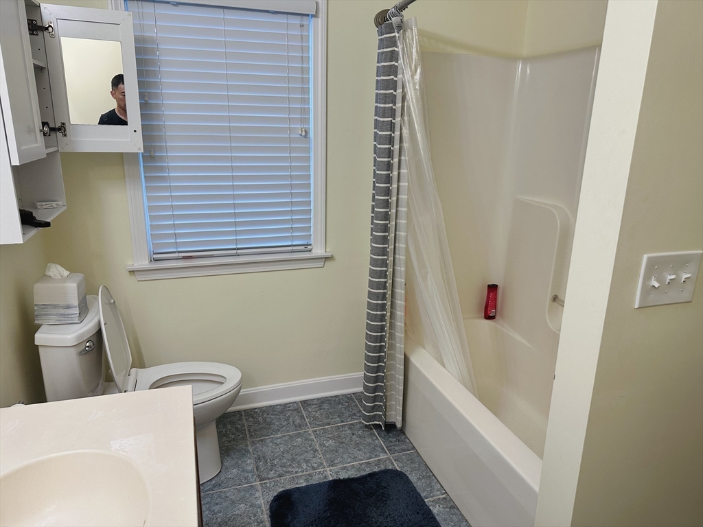 209 Adams Street, Unit B Malden, MA 02148 - Photo 14 of 30 a bathroom with a sink and a bathtub