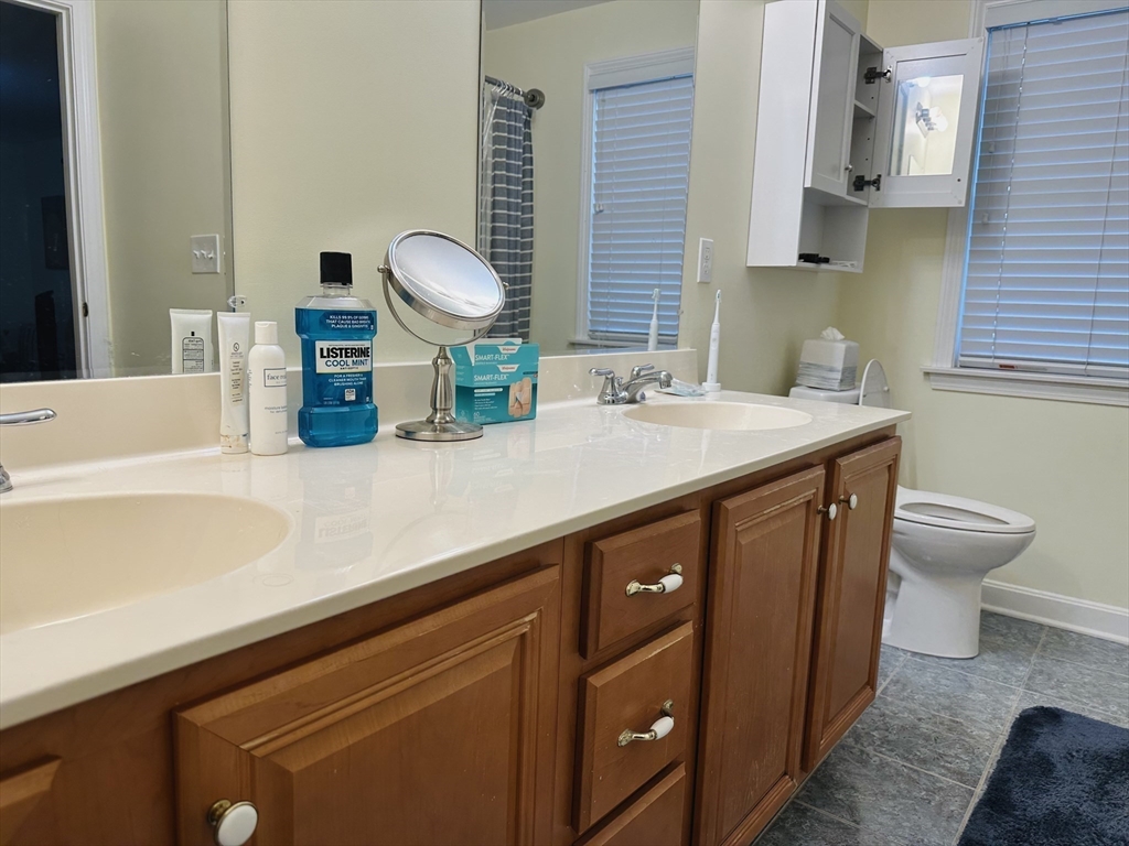 209 Adams Street, Unit B Malden, MA 02148 - Photo 15 of 30 a kitchen with a sink and a stove with wooden floor