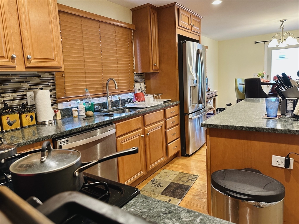 209 Adams Street, Unit B Malden, MA 02148 - Photo 4 of 30 a bathroom with a sink and a mirror