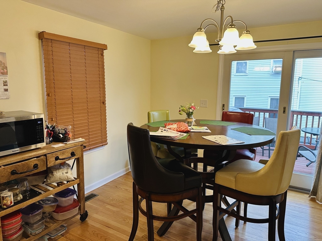 209 Adams Street, Unit B Malden, MA 02148 - Photo 7 of 30 a view of a dining room with furniture window and wooden floor