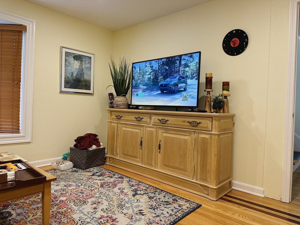 209 Adams Street, Unit B Malden, MA 02148 - Photo 9 of 30 a view of a livingroom with furniture and workspace