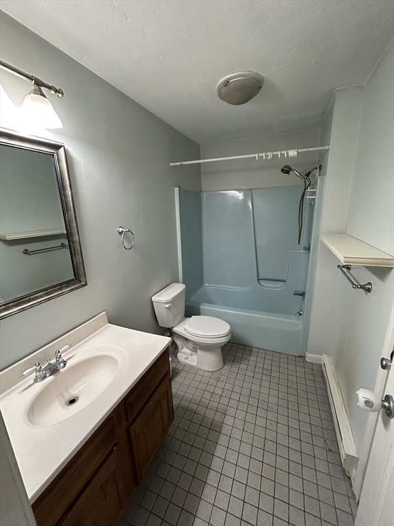 3 Hinman Street, Unit 2 Sturbridge, MA 01518 - Photo 9 of 9 a bathroom with a sink a toilet and shower