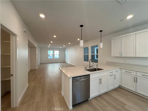 a kitchen with a sink and cabinets